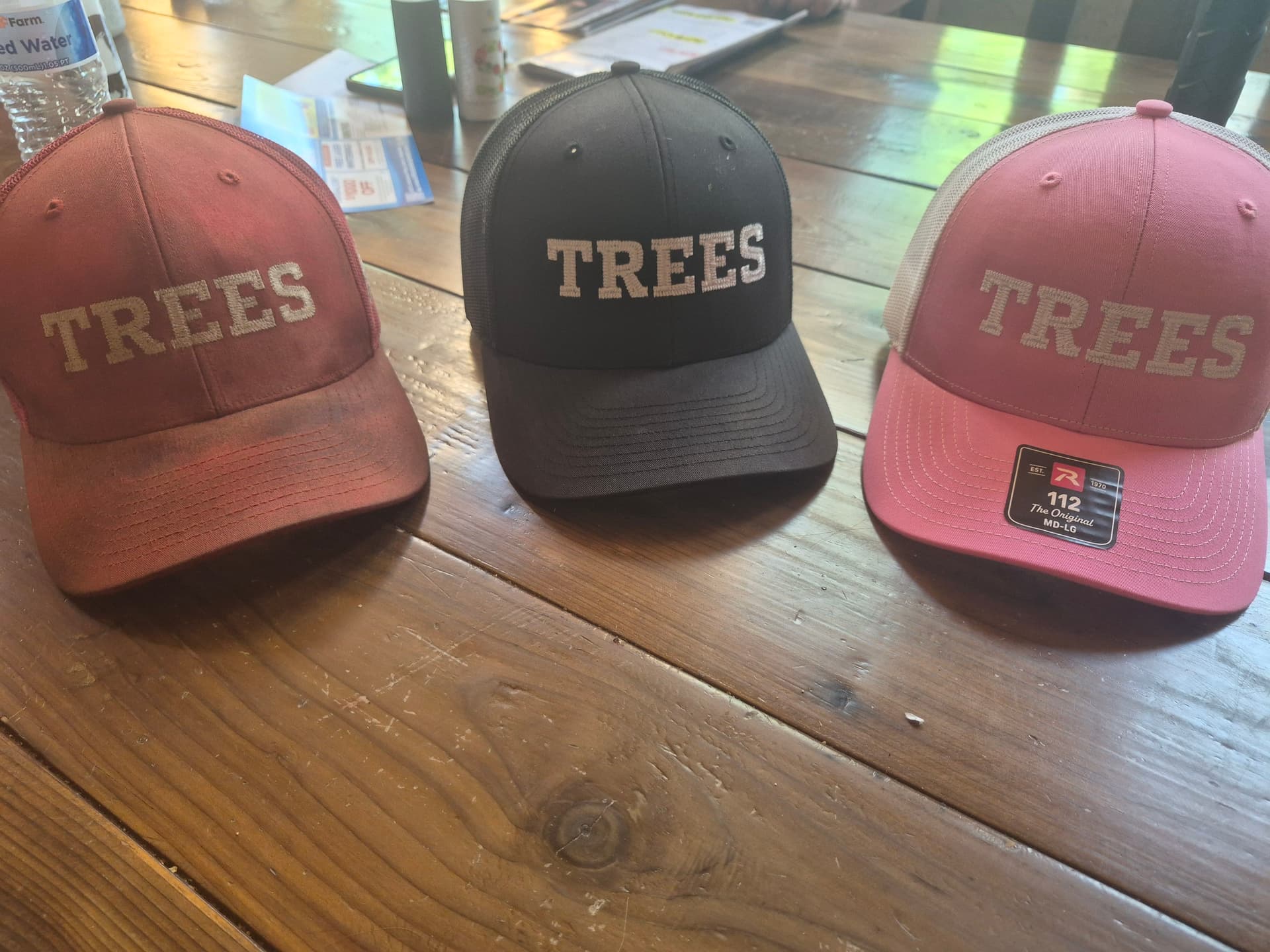 Three Hats, Three Personalities, One Family Tree Business image